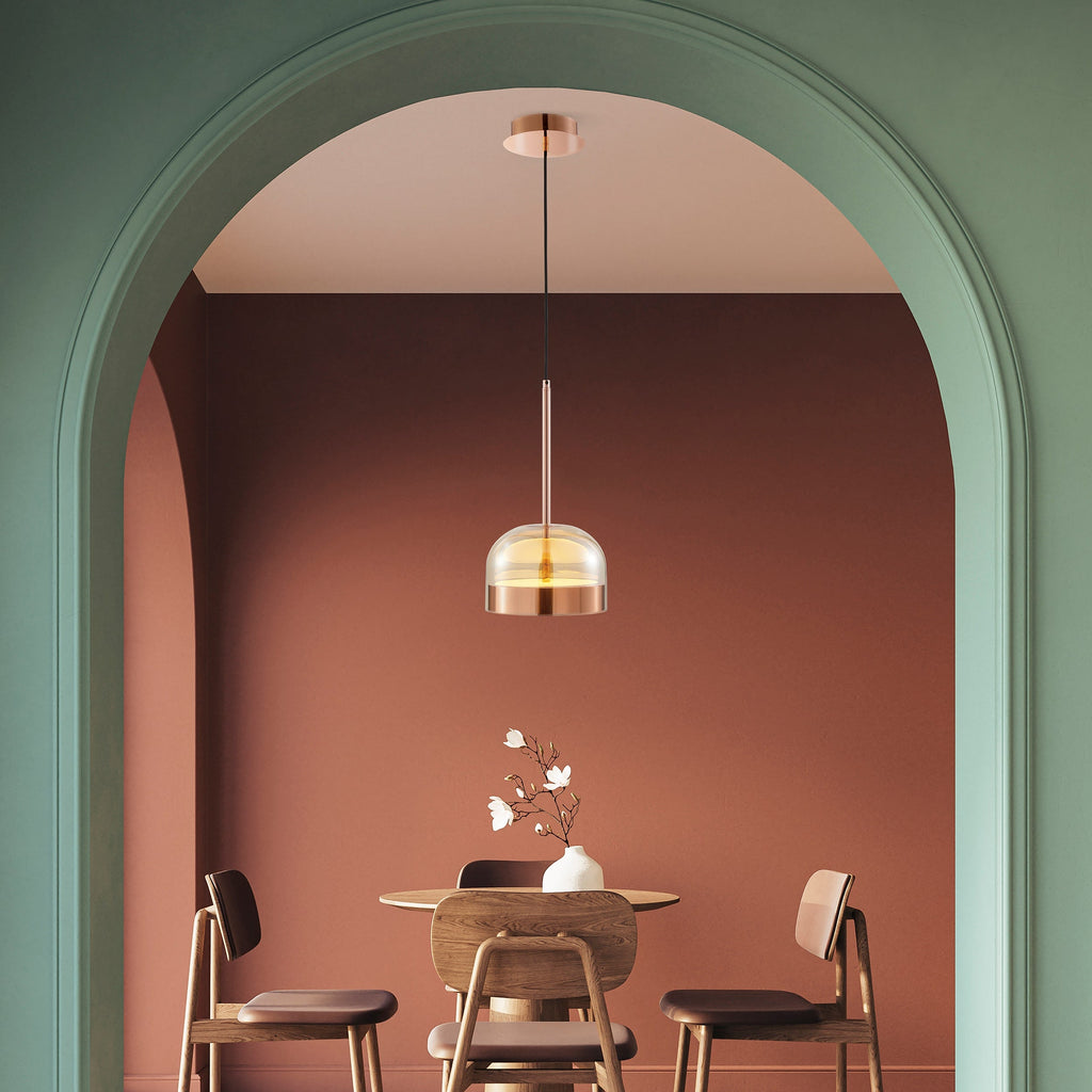Rose gold pendant with champagne glass dome and dimmable LED CCT lighting for modern spaces.