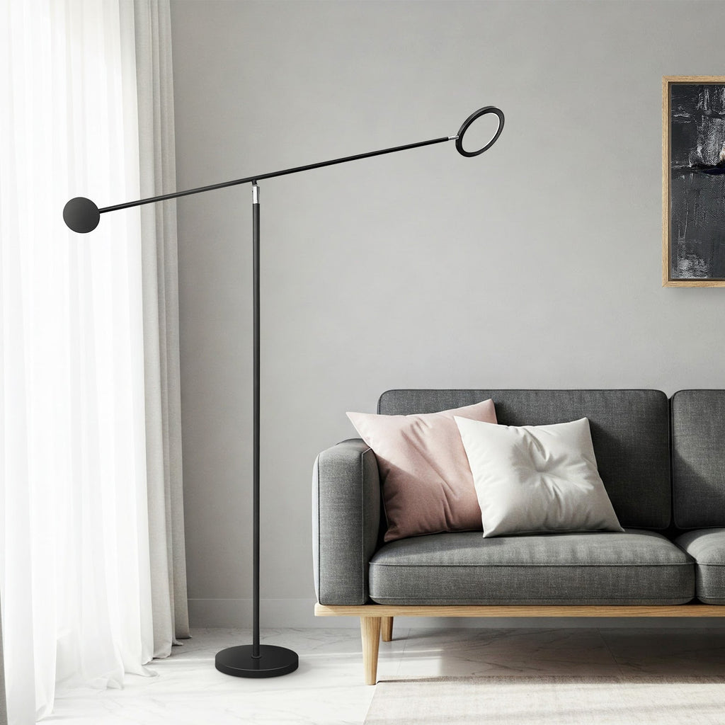 Modern black floor lamp with adjustable LED arm and ring head for task or ambient lighting.