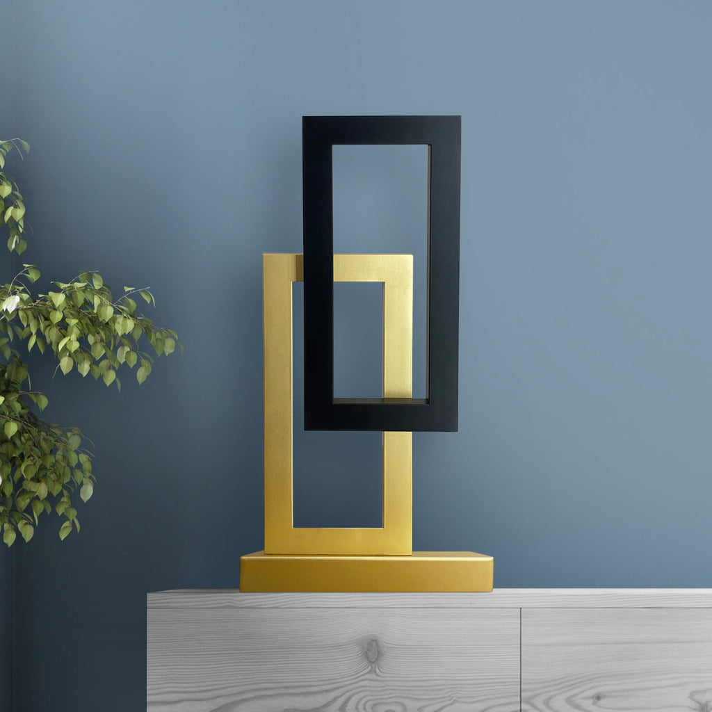 Satin black and champagne gold table lamp with 1080-lumen LED and geometric modern style.