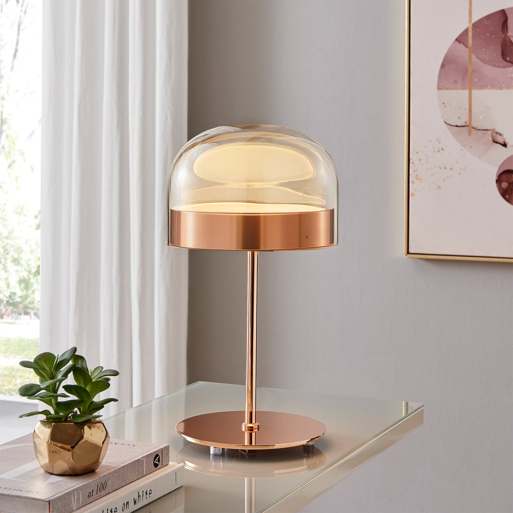 Rose gold table lamp with champagne glass dome and dimmable 1920-lumen LED light.