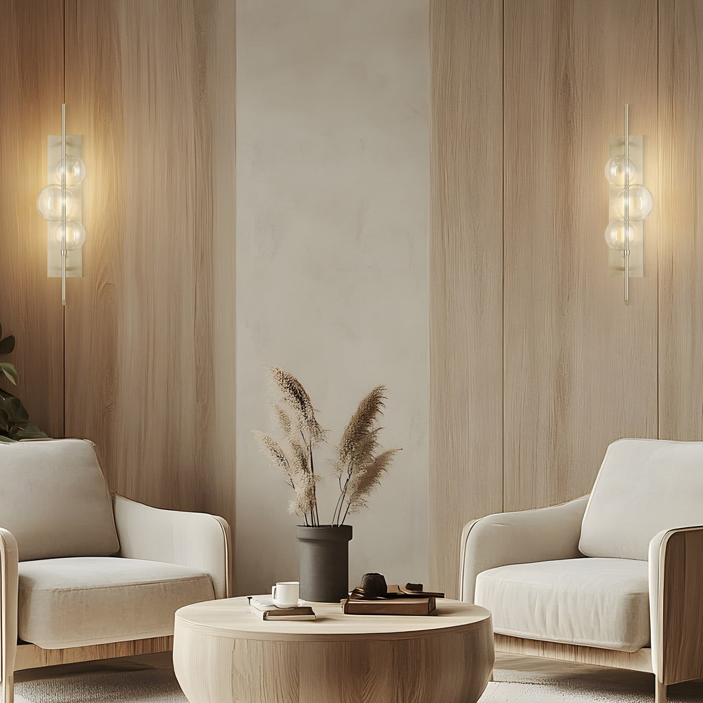 Satin nickel wall lamp with floating glass orbs and dimmable LED CCT lighting.